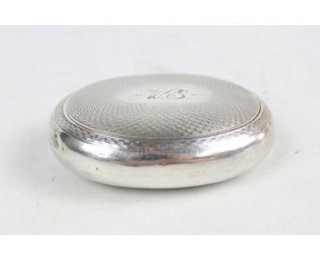 DEAKIN & FRANCIS; an Edward VII hallmarked silver oval engine turned decorated squeeze action snuff box with initialled carto