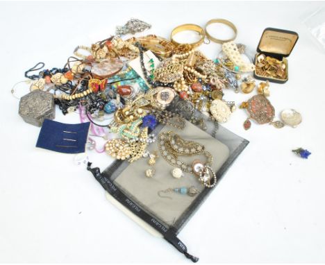 A quantity of costume jewellery to include bangles, bracelets and various bead necklaces, also a group of cufflinks to includ