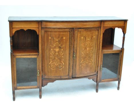 An Edwardian rosewood chiffonier and with bowfronted central doors above ring turned supports, maker's label to back inscribe