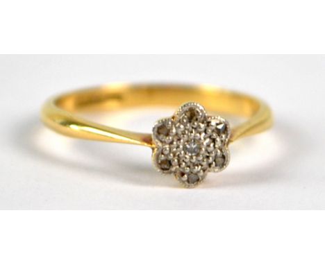 An 18ct yellow gold cluster ring set with melee diamonds within border of six diamond chips, size K, approx 1.9g.