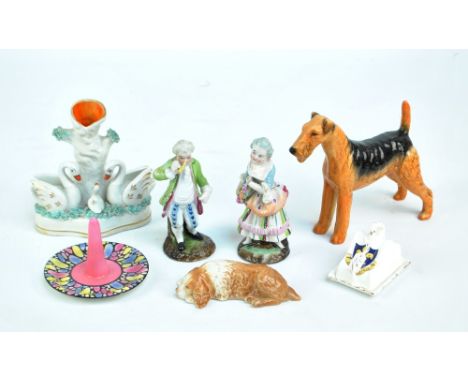 A small group of ceramics comprising a modern Staffordshire figure of swans, a Beswick Airedale 'Last Iron Monarch', a pair o