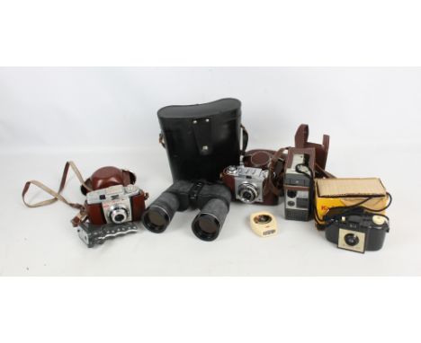 A collection of vintage cameras including a cased Zeiss Ikon, a cased Kodak Colour Snap 35, a Kodak Brownie 127 in its origin