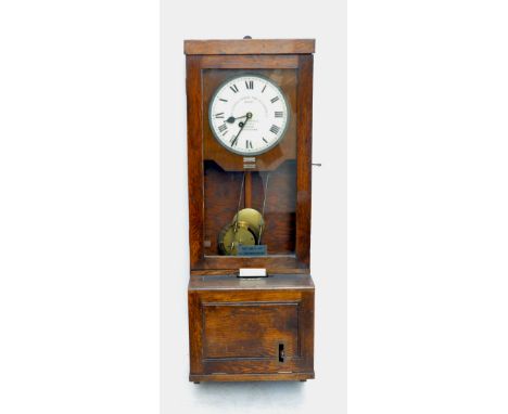 An early 20th century oak cased clocking in machine with circular enamel dial set with Roman numerals and inscribed 'The Gled