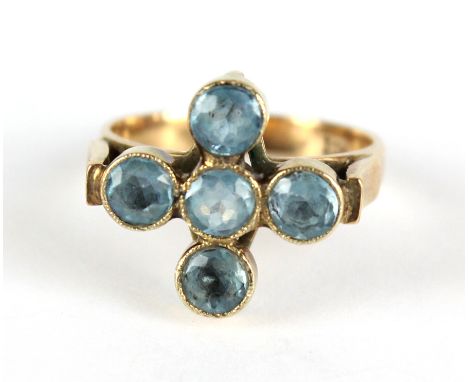 A 9ct yellow gold dress ring set with five round cut pale blue stones in bezel settings, size L, approx 3.2g.