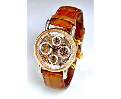 CHRONOSWISS; an 18ct yellow gold and stainless steel 'Opus' C741 skeleton wristwatch numbered 1908, boxed with papers and pur