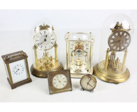 Three modern anniversary clocks to include Blandford, a brass carriage clock and two further timepieces (6).