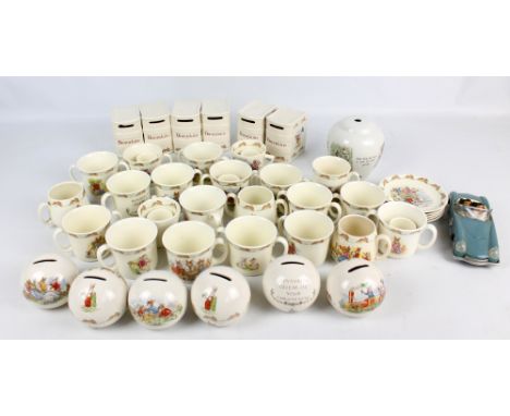 A collection of Royal Doulton 'Bunnykins' cups and saucers, twin handled mugs and egg cups, also six globular money boxes and