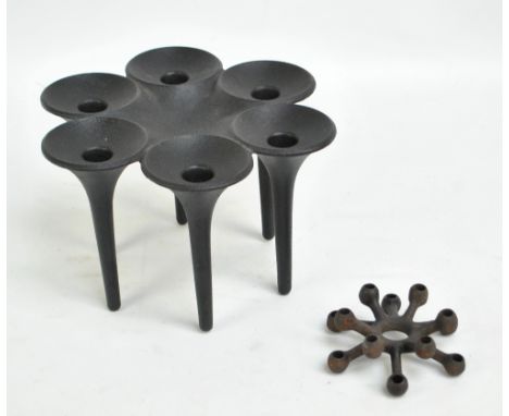 A Dansk design (Jens Quistgard) cast iron candlestick and a cast iron horn blower candle holder by Christer & Christer for Ha
