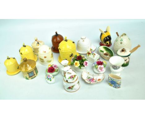 A collection of ceramic honey pots comprising examples by Griselda Hill Potteries for Wemyss Ware, Goebel, Belleek, Sylvac, C