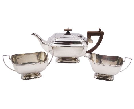 1930's three piece silver tea service, comprising teapot, twin handled sucrier, and milk jug, each of rectangular form with c