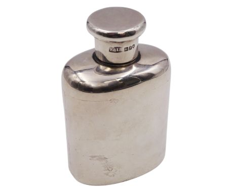 Early 20th century silver hip flask, of plain oval form with rounded shoulders and screw threaded cover, hallmarked Finnigans