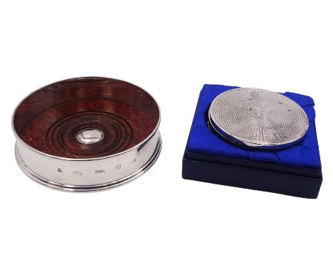 Modern silver mounted bottle coaster, of plain circular form with  turned mahogany centre, hallmarked M C Hersey & Son Ltd, L