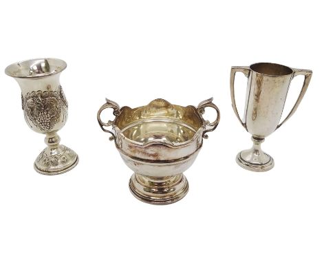 Small 1920's silver twin handled trophy bowl, with lobed rim and flying scroll handles, upon a circular stepped base, hallmar