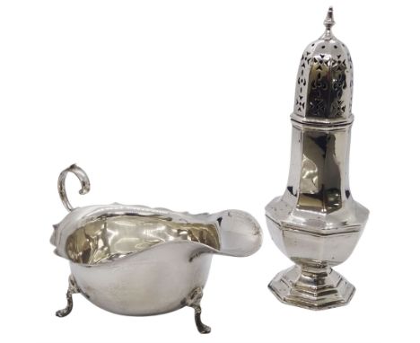 Early 20th century silver sauce boat, of typical form with flying scroll handle, upon three pad feet, hallmarked Barker Broth