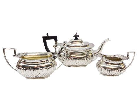 Victorian three piece silver tea service, comprising teapot with ebonised handle and finial, twin handled open sucrier, and m