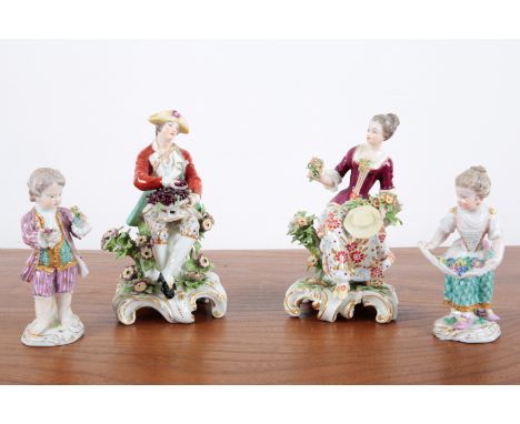 MANNER OF MEISSEN: TWO PORCELAIN FIGURES 19th century, depicting a boy and girl gathering flowers, marked with crossed swords