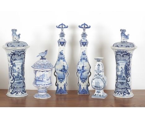 A COLLECTION OF DEFLTWARE 19th/20th century, comprising a pair of large lidded jars topped with a finial dog, 42cm high, with