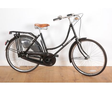 A 'MADE' SINGLE SPEED LADIES BIKEwith a step through black painted frame and spring supported seat, seat height 88cm