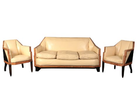 A FRENCH ART DECO THREE PIECE LOUNGE SUITEpossibly by Jacques Arnauld, in burr satinwood with ebonised panels and cream leath