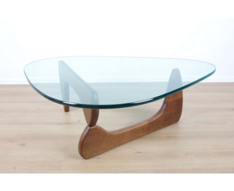 A NOGUCHI WALNUT COFFEE TABLE BY VITRA LTDthe rounded triangular glass top over a base comprised of two shaped walnut element