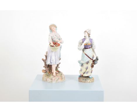 A PAIR OF PORCELAIN PROVINCIAL FEMALE FIGURESone gazing upwards with windswept dress holding a ewer in one hand, crossed swor