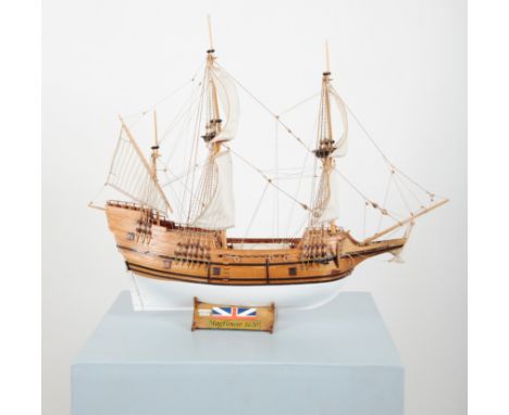 A WOODEN SCALE MODEL OF THE 'MAYFLOWER'the vessel complete with two crow's nests, six striped sails, and twin metal anchors, 