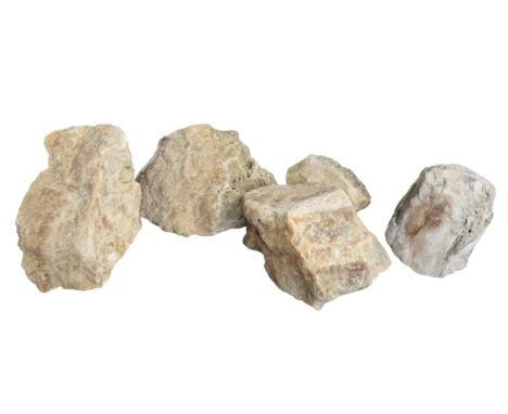 A GROUP OF FOUR AMBER QUARTZ STONES 33cm, 25cm, 23cm and 13cm high; together with a crystal stone, 22cm high (5)