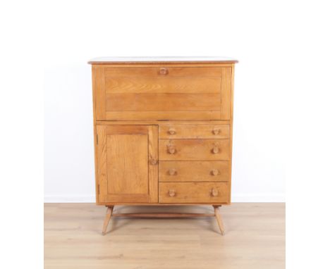 ERCOL, MODEL NO. 330: A BEECH AND ELM COCKTAIL CABINETmid-century modern, the fall front opening to reveal a single shelf int