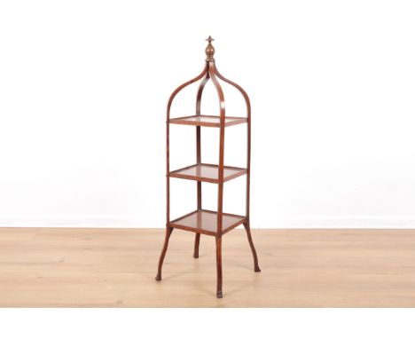 AN EDWARDIAN MAHOGANY THREE TIER CAKE STANDinlaid with satinwood stringing throughout, the apex with baluster finial and of c