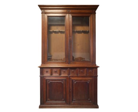 A VICTORIAN OAK GUN CABINET 19th century, the glazed upper section with gun racks to the interior (currently locked with no k