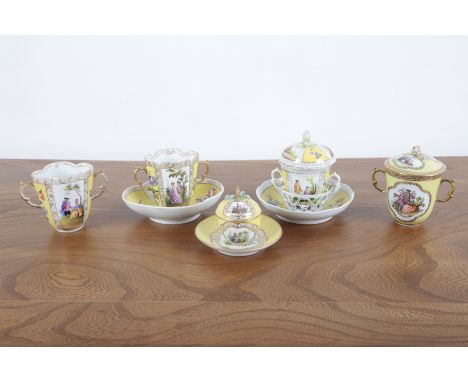 A COLLECTION OF DRESDEN CABINETWARE 19th century, including various cups and saucers with figural scenes surmounted by gilt b