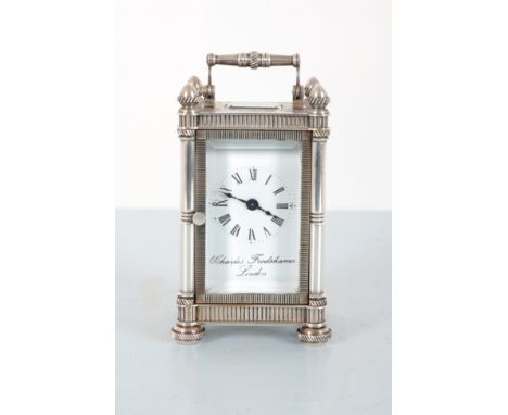 CHARLES FRODSHAM, LONDON: A MINIATURE WHITE METAL ENGRAVED CARRIAGE CLOCKthe top with acorn finial to each corner, foliate en