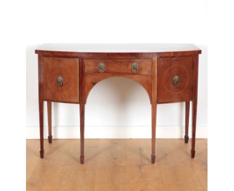 A GEORGE IV MAHOGANY AND SATINWOOD INLAID BOW FRONT SIDEBOARDa central drawer flanked by two side doors, with lion head ring 