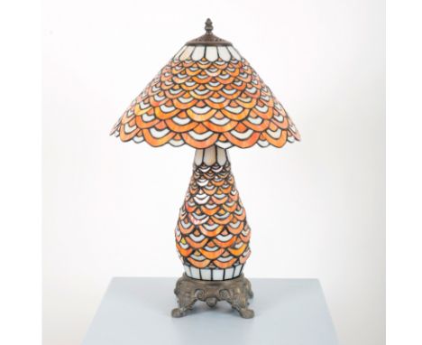A TIFFANY STYLE BALUSTER LAMP AND SHADEthe fish scale opaque orange and white glass, with fixed metal base terminating on scr