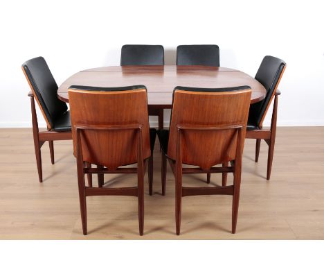 ELLIOTS OF NEWBURY: A TEAK DINING SUITEmid-century modern, the six chairs covered in black vinyl with exposed wood shield-sha