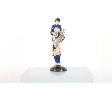 JOSEF LORENZL (1892-1950) FOR GOLDSCHEIDER: AN ART DECO FIGURE OF A CHINESE LADY WITH A FANearly 20th century, clad in cobalt