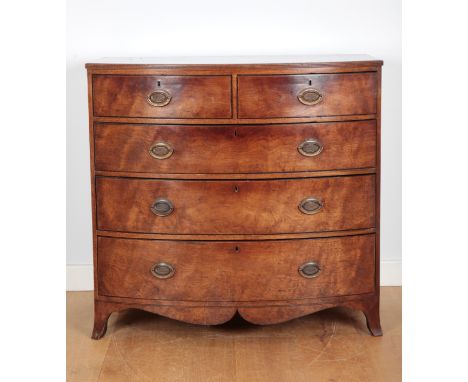 A GEORGE III MAHOGANY BOW FRONT CHEST OF DRAWERSwith a reeded top edge, two short and three long graduated drawers terminatin