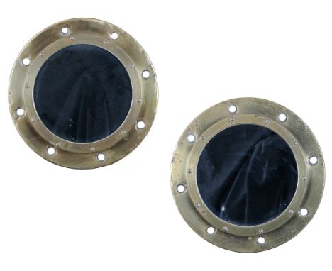 A PAIR OF RIVETTED BRASS PORT HOLE MIRRORS38cm diameter, with a black and white photograph of the liner from which they were 