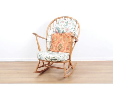 ERCOL, MODEL NO. 315: AN ELM 'GRANDFATHER' ROCKING CHAIRmid-century modern, the hooped back with turned supports over a shape