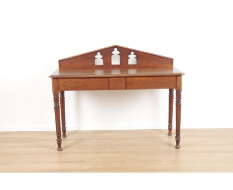 A VICTORIAN MAHOGANY GOTHIC REVIVAL SIDE TABLE OR SIDEBOARDwith pediment back board pierced with three trefoil topped arches 