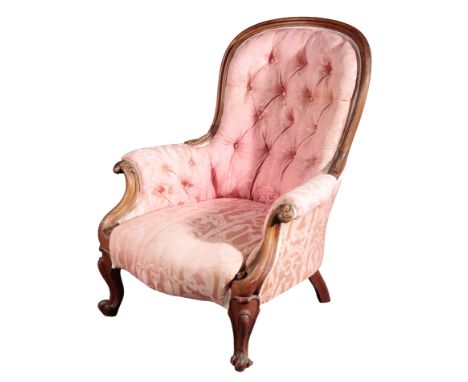 A VICTORIAN MAHOGANY SPOONBACK ARMCHAIRwith acanthus scroll cresting and button-back pink damask upholstery, the cabriole leg