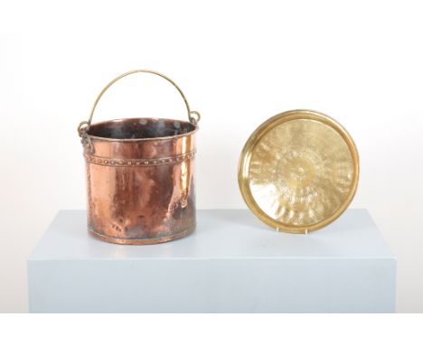 A VICTORIAN RIVETTED COPPER COAL OR LOG BINwith planished surface and carrying handles to the side, 32cm high x 32 cm diamete