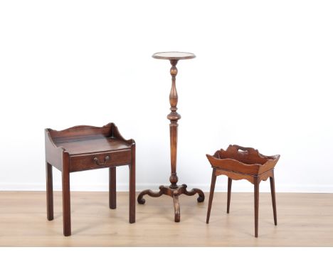 A VICTORIAN MAHOGANY TRIPOD TORCHERE OR JARDINIERE STANDwith turned baluster stem terminating on scrolled feet, 109cm high x 