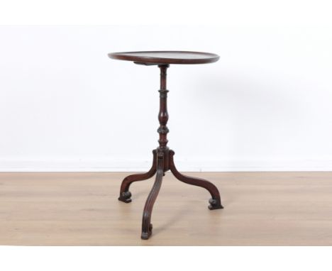 A GEORGE III STYLE MAHOGANY WINE TABLEthe circular top on a slender baluster turned column, the three scrolling moulded legs 