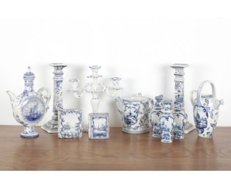A LARGE COLLECTION OF DELFTWARE 19th/20th century, comprising a pair of candlesticks decorated with flora and fauna, 29cm hig
