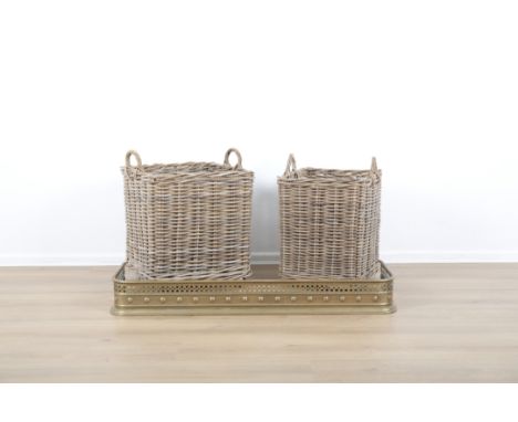 TWO COUNTRY HOUSE WICKER LOG BASKETSboth with carrying handles and terminating on castors, the taller of the two 57cm high x 
