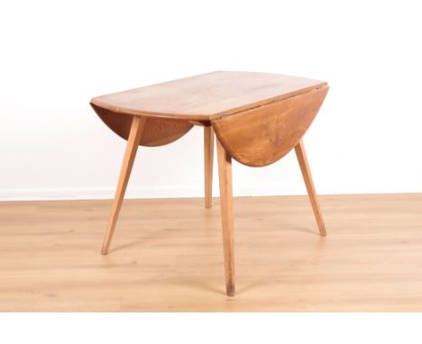 ERCOL, MODEL NO. 384: AN ELM AND BEECH WINDSOR DROP-LEAF TABLEthe circular top over splayed legs, with Ercol label to the und