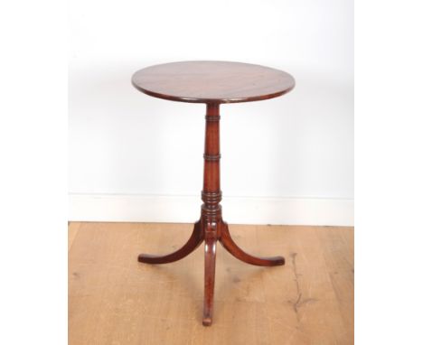 A GEORGE III MAHOGANY CIRCULAR TRIPOD TABLEwith turned central column and splayed legs, 74cm high x 54cm diameter