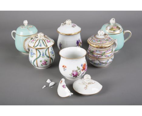 A GROUP OF FOUR DRESDEN CUP AND COVERS three marked to the base 'Dresden'; together with two others with turquoise ground and