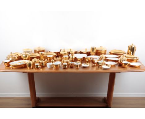 A LARGE GOLD LUSTRE ROYAL WORCESTER SERVICE including teapots, teacups, saucers, plates, ramekins, soup bowls, ramekins, ture
